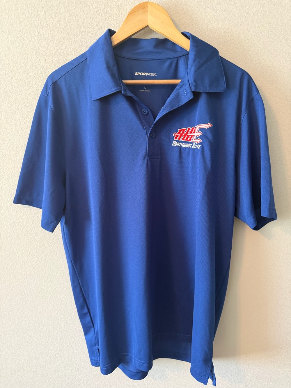 Sport-Tek Blue Polo with Northwest Elite Chest Logo